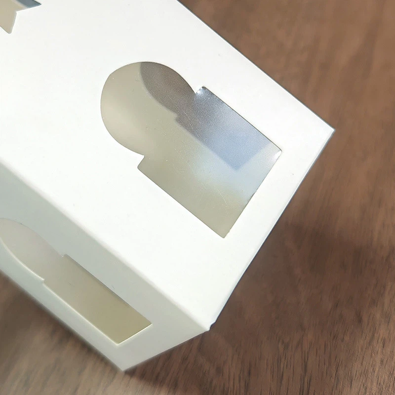 White openwork stars moon transparent window folding carton White openwork stars moon transparent window folding carton